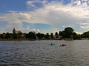 Old water tower and bridge for bicycles and pedestrians along the Amstel in Amsterdam South